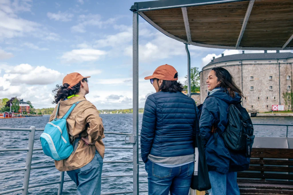 Guests on a boat deck on the Stockholm & Vaxholm tour