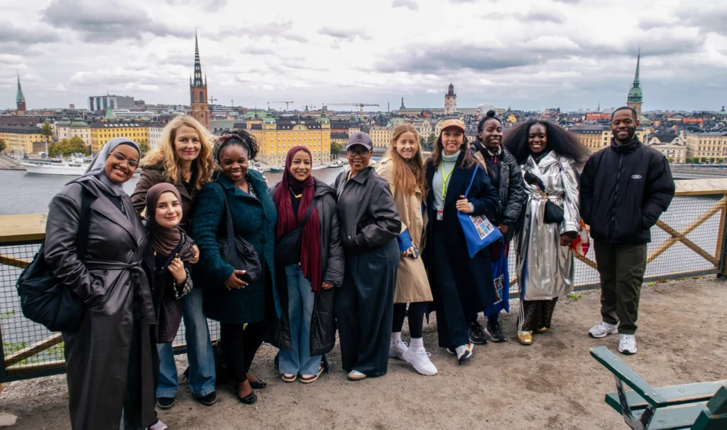 Tour group above Stockholm's rooftops on the Lola Akinmade tour