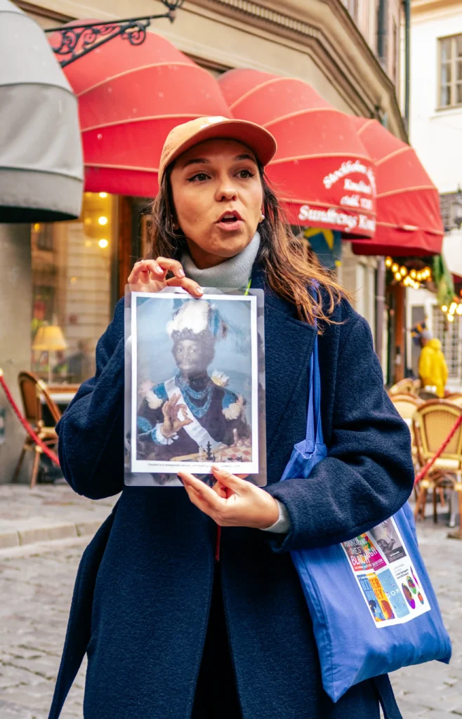 Ana showing a photo on the Lola Akinmade Book Club tour