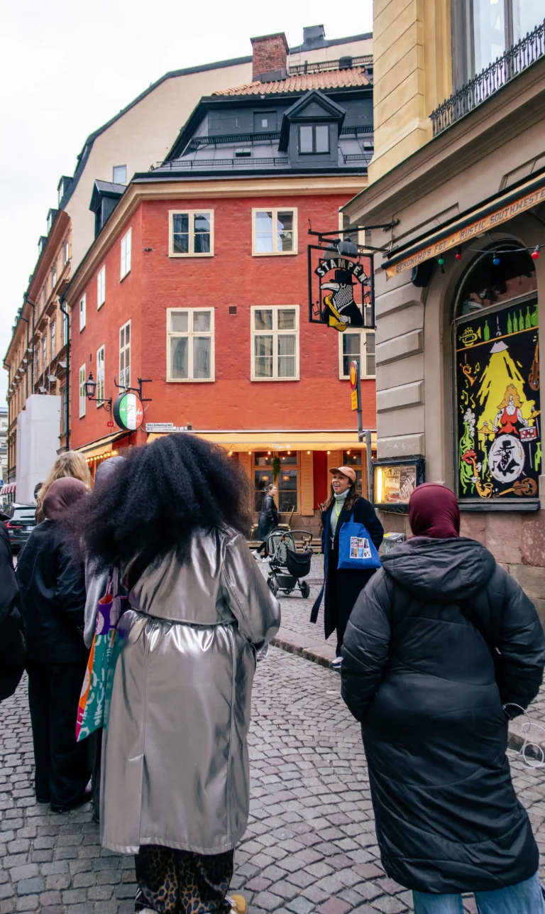 Tour group on a Stockholm street at the first stop of the Lola Akinmade tour